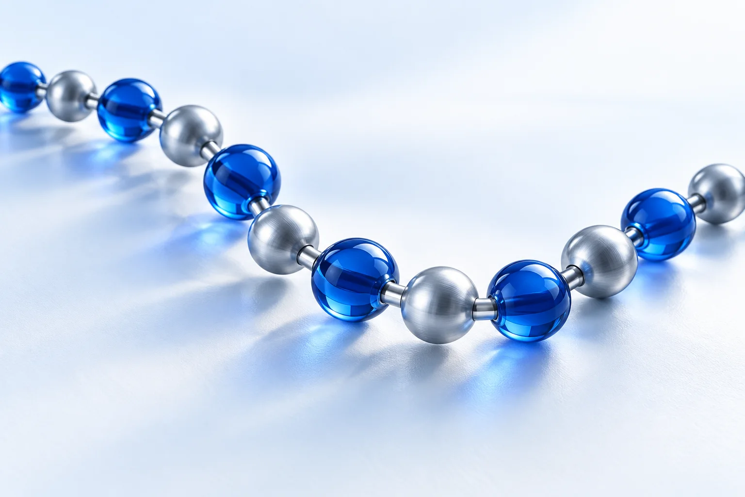 A sculptural sequence of connected blue and silver forms illustrating the idea of a peptide chain.